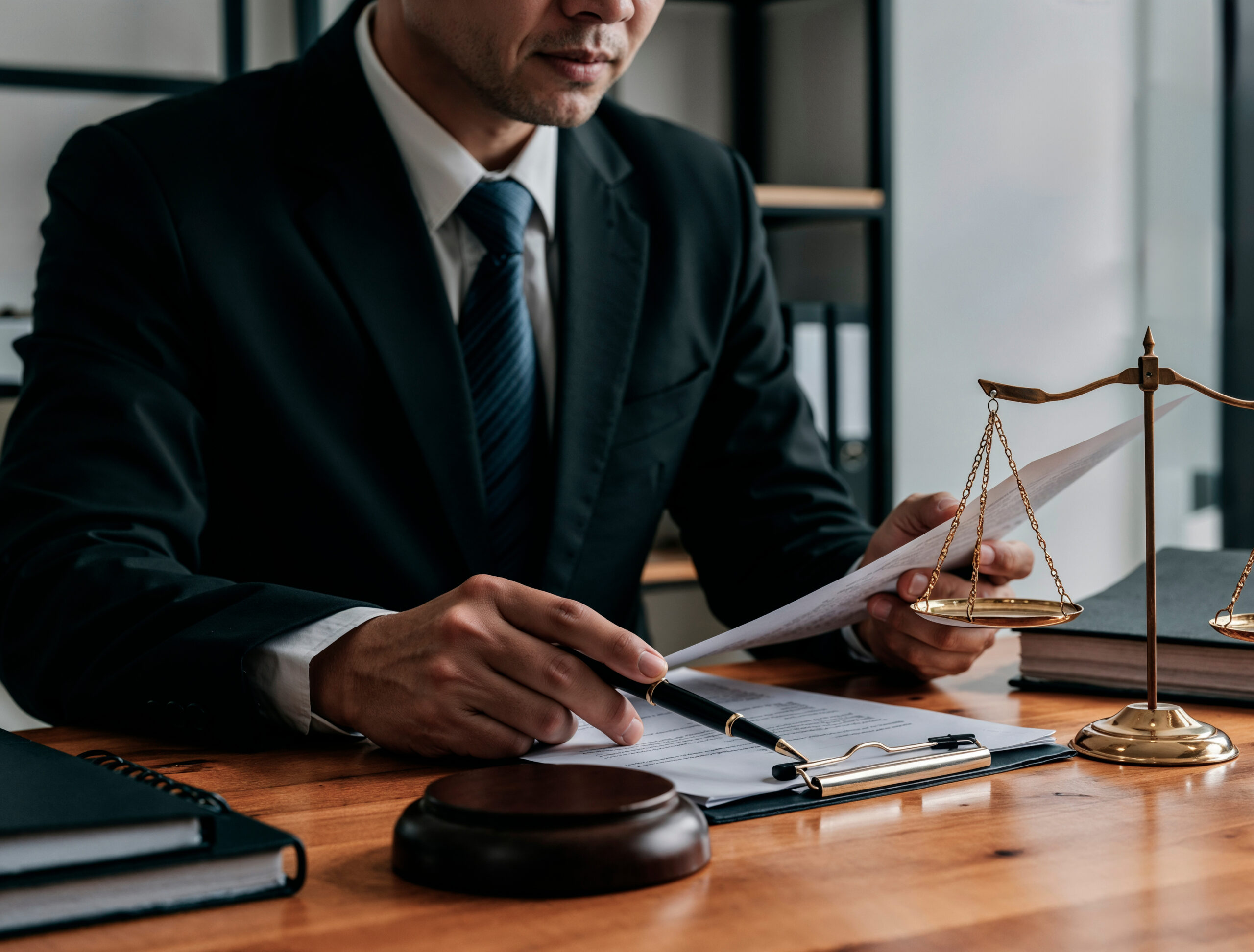 lawyer-working-document-with-scales-justice